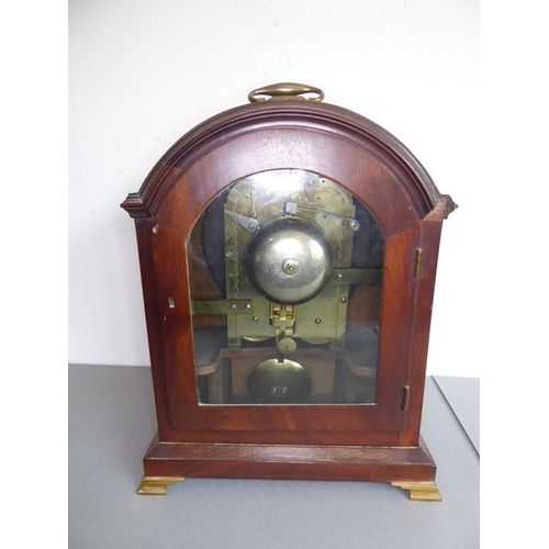 264 - A 19th century mahogany and boxwood-strung eight-day bracket clock; the oval hinged gilt-metal handl... 