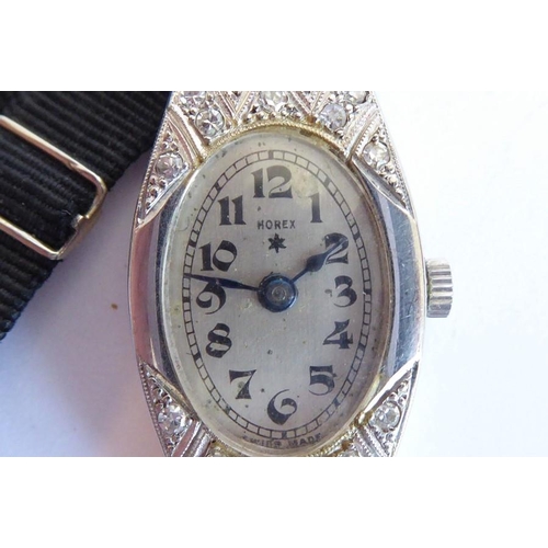 266 - A lady's dress watch, the tonneau-shaped dial with Arabic numerals and signed 'HOREX' the engraved c... 