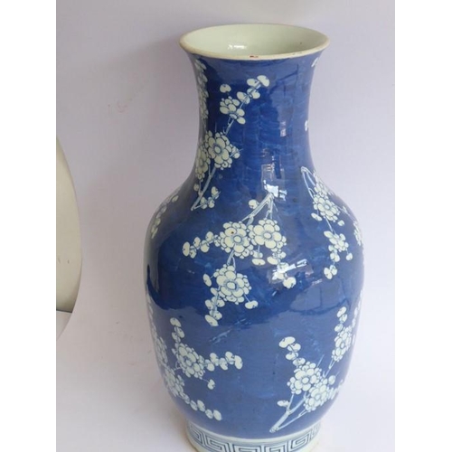 27 - A late 19th century Chinese porcelain vase of baluster form; hand-decorated in underglaze blue with ... 