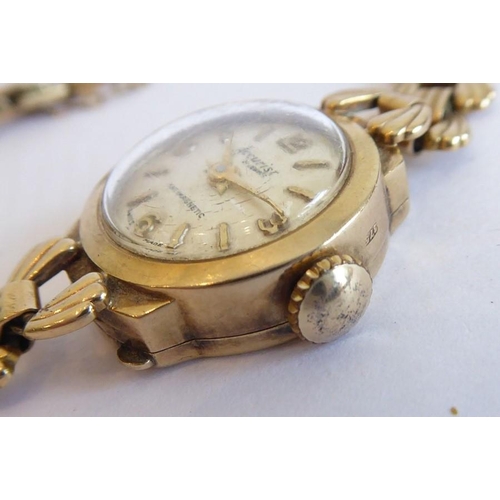 272 - A lady's 9 carat yellow gold wristwatch by Accurist; the circular dial with Arabic numerals and bato... 