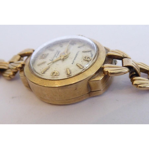 272 - A lady's 9 carat yellow gold wristwatch by Accurist; the circular dial with Arabic numerals and bato... 