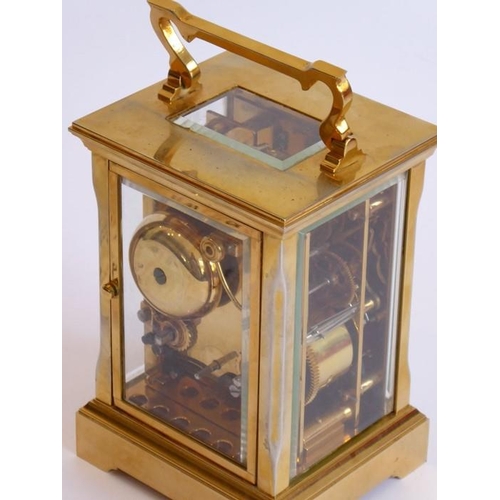 274 - A good modern gilt metal and glass sided carriage clock; the white enamel dial with Roman numerals a... 