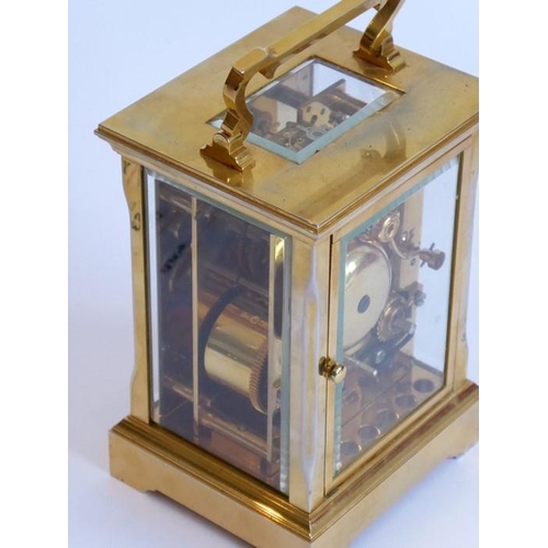 274 - A good modern gilt metal and glass sided carriage clock; the white enamel dial with Roman numerals a... 