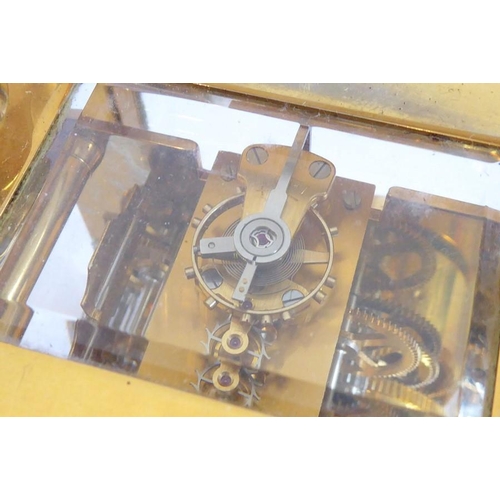 274 - A good modern gilt metal and glass sided carriage clock; the white enamel dial with Roman numerals a... 