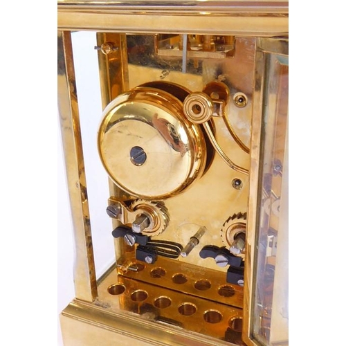 274 - A good modern gilt metal and glass sided carriage clock; the white enamel dial with Roman numerals a... 