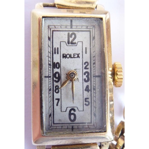 277 - A 9 carat yellow gold rectangular watch, the dial with Arabic numerals signed 'Rolex', the case sign... 