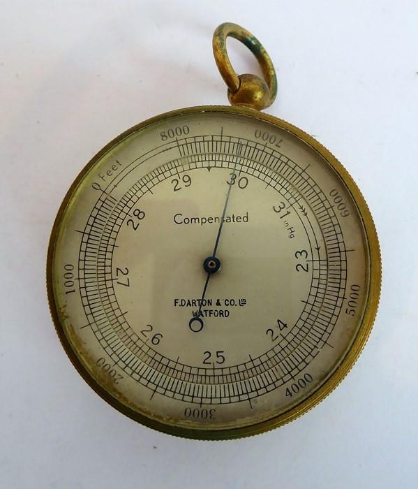 A late 19th / early 20th century handheld barometer-altimeter; the dial  marked 'Compensated' and 'F.