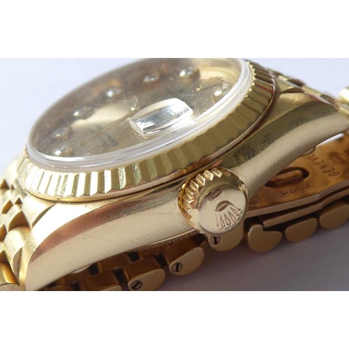 283A - A lady's 18 carat yellow gold and diamond-set Oyster Perpetual Datejust Chronometer by Rolex,  the s... 