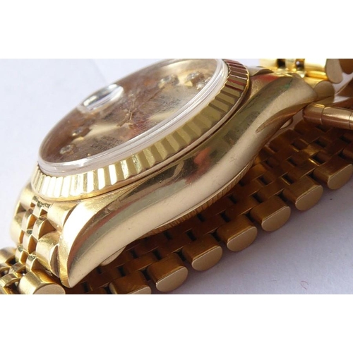 283A - A lady's 18 carat yellow gold and diamond-set Oyster Perpetual Datejust Chronometer by Rolex,  the s... 