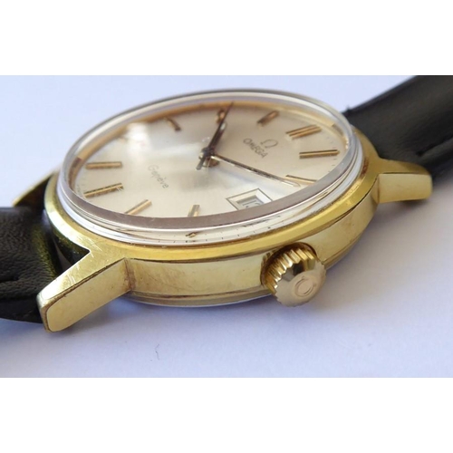 296 - A gentleman's Omega dress wristwatch; gold-plated case and then signed dial with baton markers and d... 