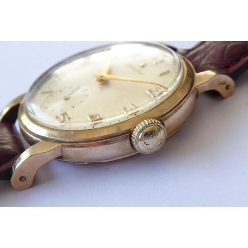 301 - A gentleman's 9-carat yellow-gold-cased wristwatch; the cream dial signed Zenith and with Arabic num... 