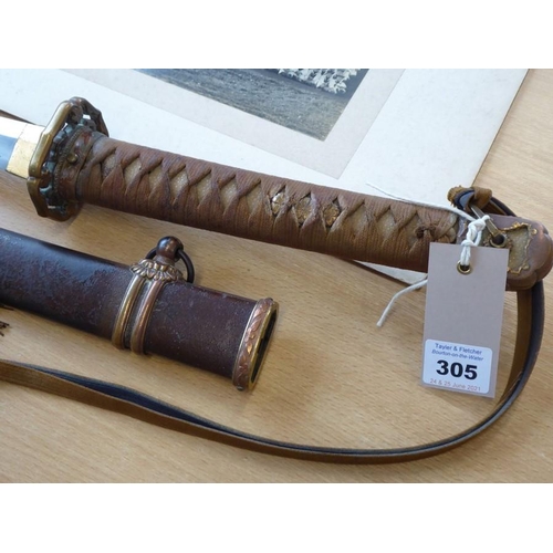 305 - A Japanese Katana; the tightly bound shagreen handle terminating in a patinated copper end decorated... 