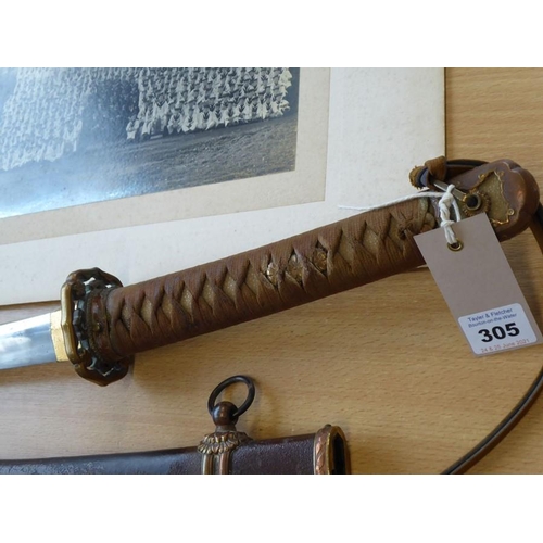 305 - A Japanese Katana; the tightly bound shagreen handle terminating in a patinated copper end decorated... 