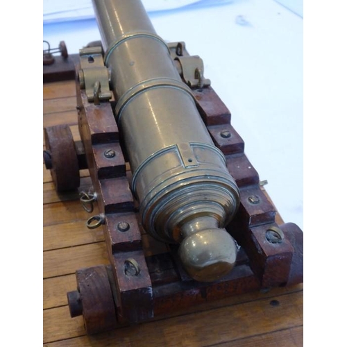 306 - An excellent scale model of an English brass 32 pdr. deck cannon (originally circa 1780); the heavy ... 