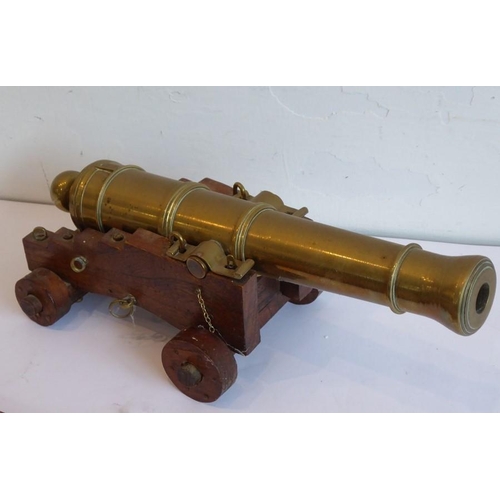 306 - An excellent scale model of an English brass 32 pdr. deck cannon (originally circa 1780); the heavy ... 