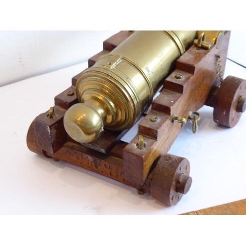 306 - An excellent scale model of an English brass 32 pdr. deck cannon (originally circa 1780); the heavy ... 