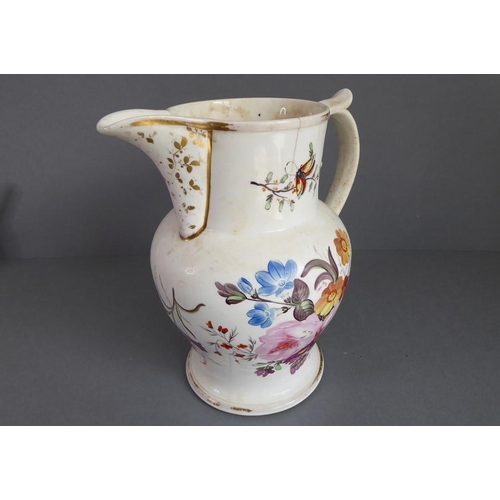 32 - An assortment of ceramics to include a large mid-19th century jug hand-decorated with insects and fl... 