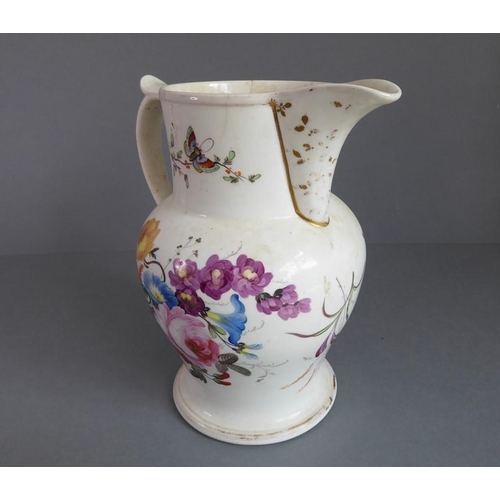 32 - An assortment of ceramics to include a large mid-19th century jug hand-decorated with insects and fl... 