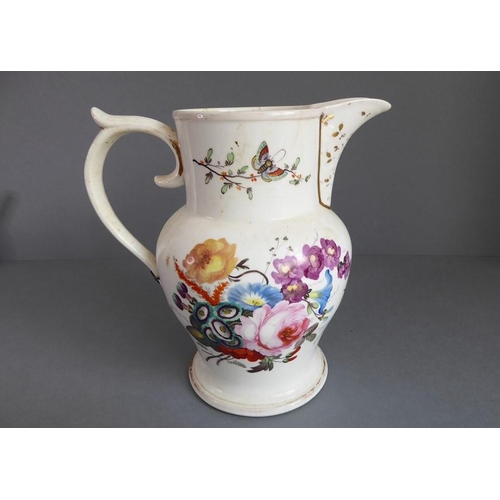 32 - An assortment of ceramics to include a large mid-19th century jug hand-decorated with insects and fl... 