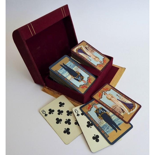 321 - A mid-20th century boxed double set of playing cards produced to commemorate the Coronation in 1953