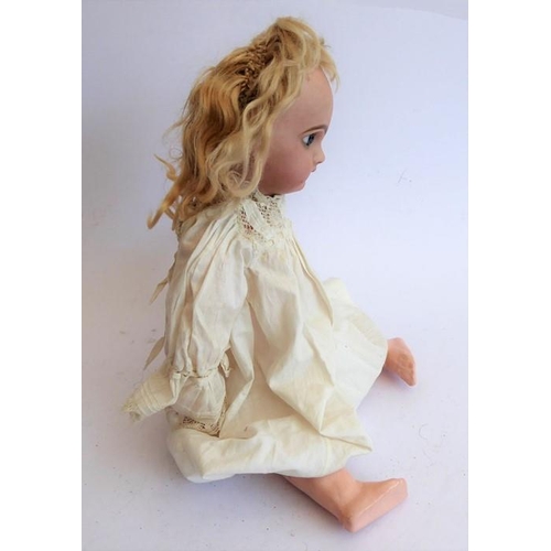 327 - A late 19th century bisque head doll; the back of the head stamped in red 'Tête Juméau'; curly blond... 