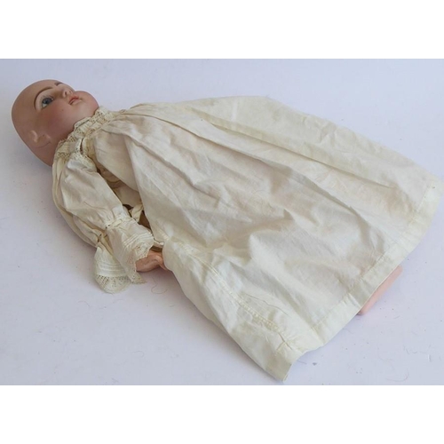 327 - A late 19th century bisque head doll; the back of the head stamped in red 'Tête Juméau'; curly blond... 