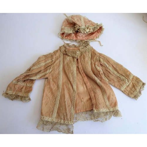 328 - A very good selection of early dolls clothing etc. to include lacework dresses, a pair of skirts, so... 