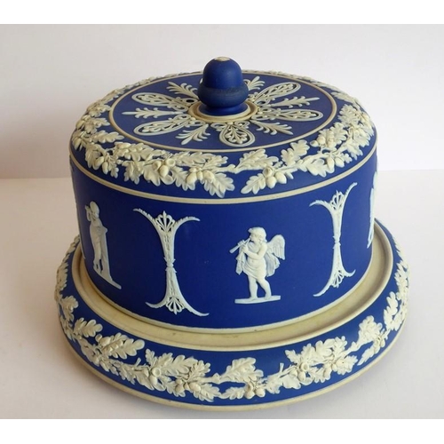 33 - Two 19th century (one large and one small) blue and white Jasperware Stilton covers and stands; the ... 