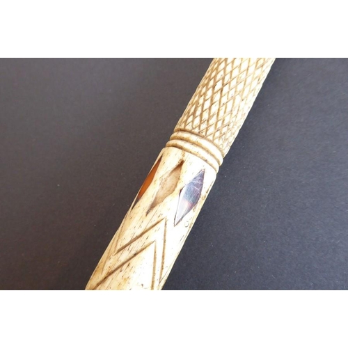 330 - A 19th century carved and tortoiseshell inlaid walking cane fashioned from a Narwhal tusk; the turne... 