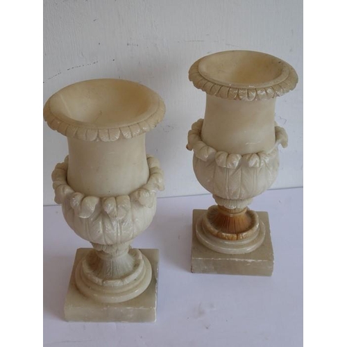 336 - A pair of 19th century alabaster urns carved in campana-style, together with a pair of 19th century ... 