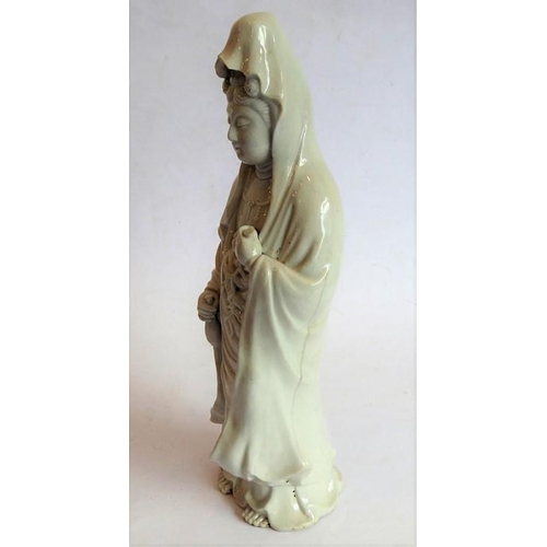 34 - A finely modelled Japanese blanc de chine ceramic model of the Japanese goddess Kannonsama; she wear... 