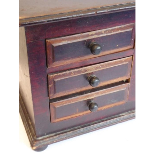 341 - A 19th century painted six drawer table cabinet; the lower moulding above four bun-style feet (40.5c... 