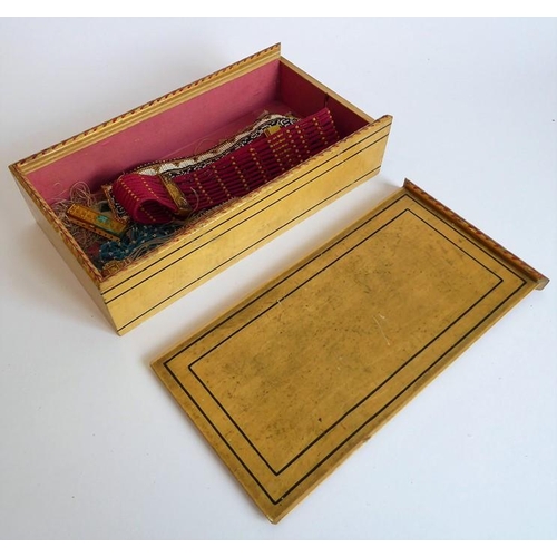 345 - A 19th century painted box with sliding lid containing an assortment of hand-made beadwork bracelets... 