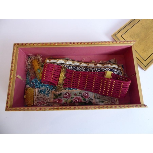 345 - A 19th century painted box with sliding lid containing an assortment of hand-made beadwork bracelets... 