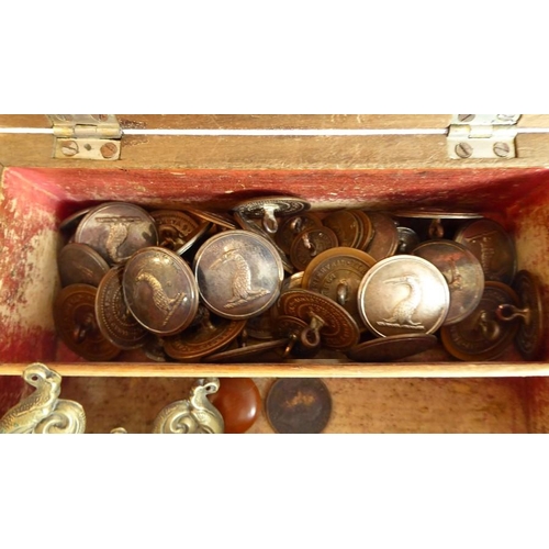 347 - A George III period box with kite-shaped escutcheon containing a variety of silver plated round butt... 