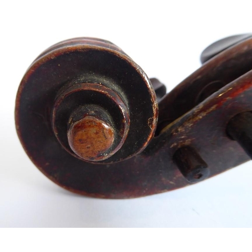 359 - A 19th century cased violin (later bow); the dark and patinated instrument with tightly carved scrol... 