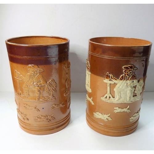 36 - Two similar 19th century salt glaze Doulton Lambeth tankards; typically decorated in relief with hun... 