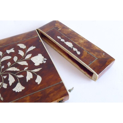 363 - A mid-19th century tortoiseshell card case inlaid with floral designs in mother of pearl (10.5cm x 8... 