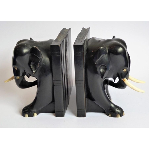 365 - A pair of early 20th century heavy early ebony bookends modelled as African elephants (16cm wide x 1... 