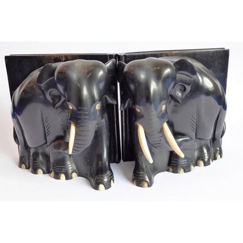 365 - A pair of early 20th century heavy early ebony bookends modelled as African elephants (16cm wide x 1... 