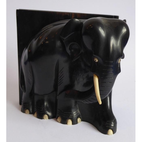 365 - A pair of early 20th century heavy early ebony bookends modelled as African elephants (16cm wide x 1... 