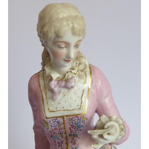 37 - Two large hand-decorated Continental porcelain figure models; each with hair tied back and respectiv... 