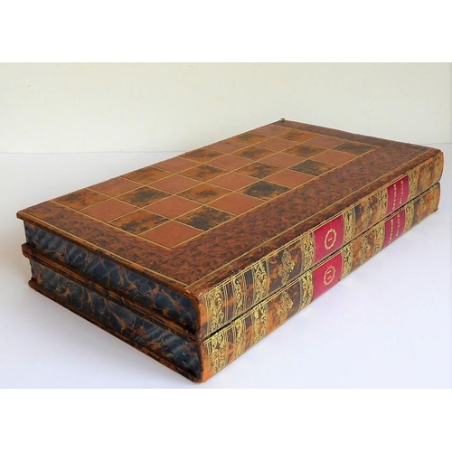 385 - A 19th century leather-bound games board (as two volumes); the folding books opening to reveal inner... 