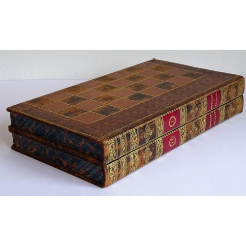 385 - A 19th century leather-bound games board (as two volumes); the folding books opening to reveal inner... 