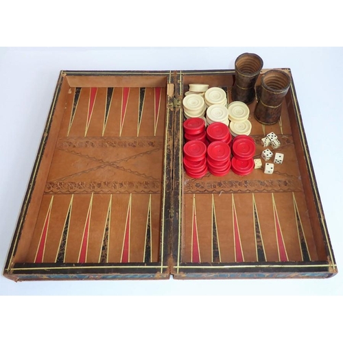 385 - A 19th century leather-bound games board (as two volumes); the folding books opening to reveal inner... 