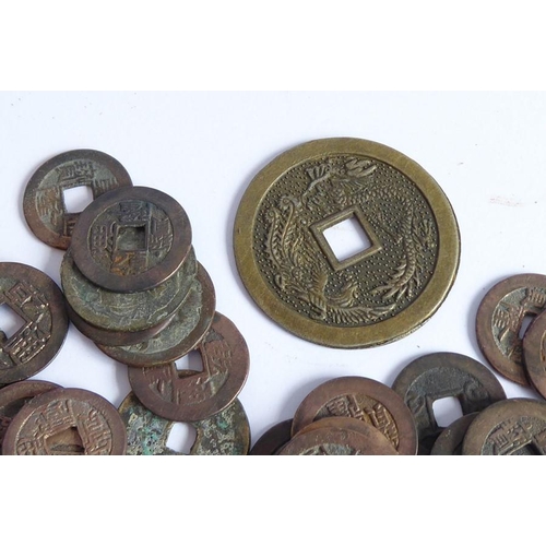 389 - A selection of various old Chinese coinage of different sizes and shapes and with square holes throu... 