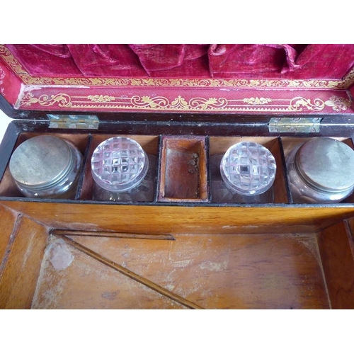 395 - A mid 19th century faded rosewood and mother of pearl inlaid vanity case; the lid opening to reveal ... 