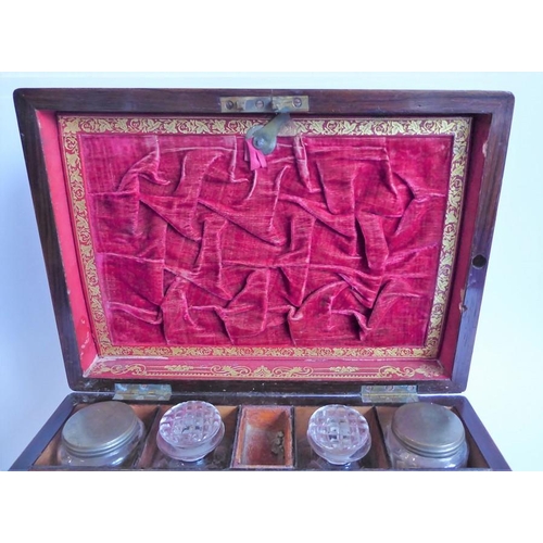 395 - A mid 19th century faded rosewood and mother of pearl inlaid vanity case; the lid opening to reveal ... 