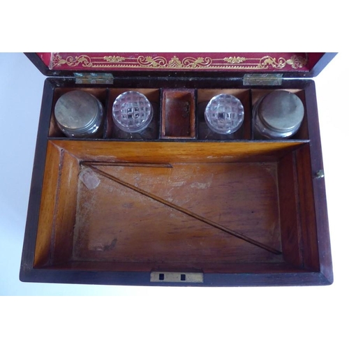 395 - A mid 19th century faded rosewood and mother of pearl inlaid vanity case; the lid opening to reveal ... 