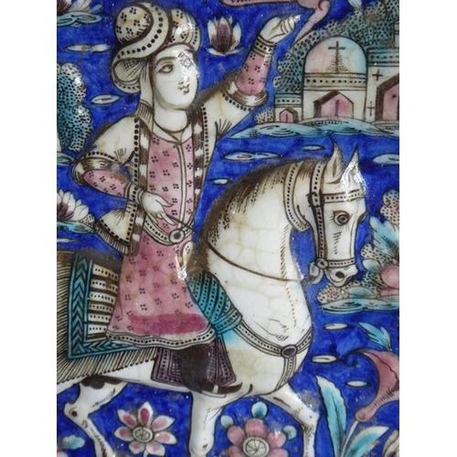 4 - Four early to mid-19th century hand-decorated Persian tiles; each depicting a mounted rider, his lef... 